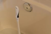 Use A Plunger To Dislodge Wad Of Hair Plugging Bathtub Drain throughout measurements 2304 X 3456