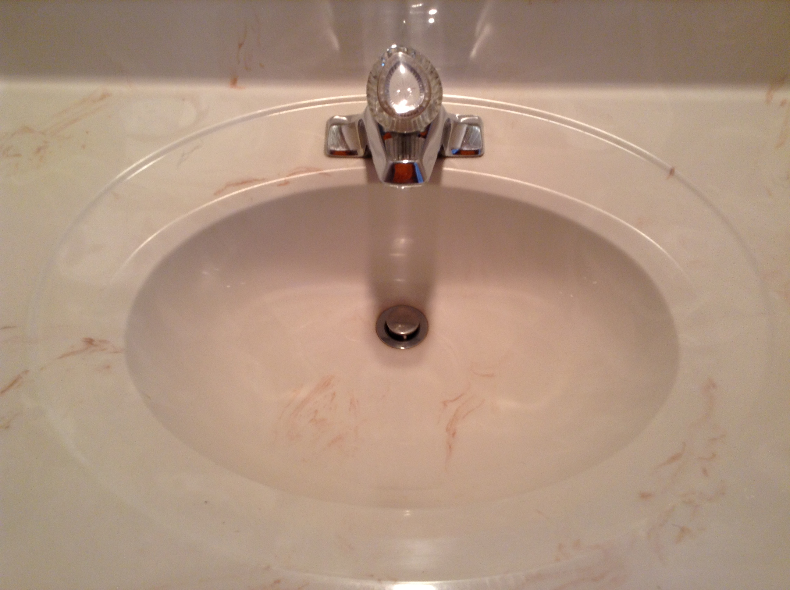 yellow brown bacteria around bathroom sink